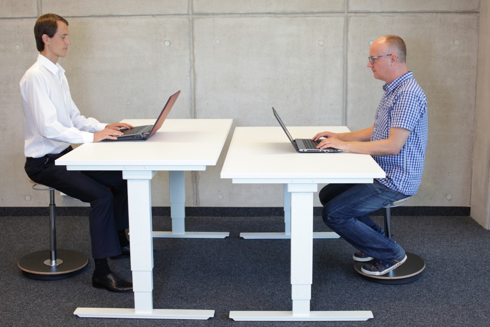 coworkers in correct sitting posture on leaning seats